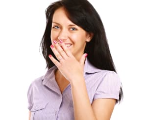 woman embarrassed by chipped or worn teeth